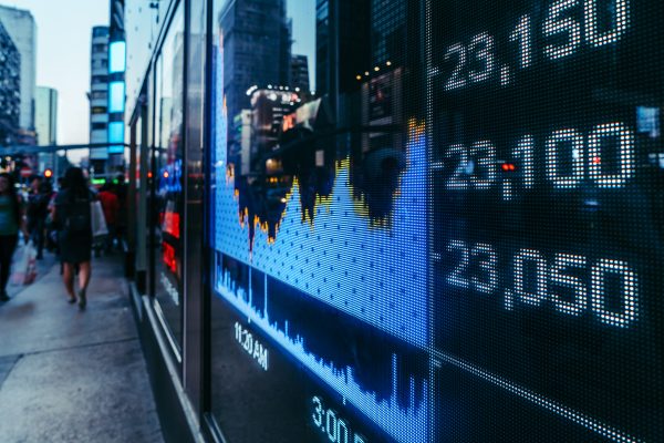 Display stock market numbers with defocused street lights backgr